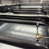 Detalhes dos queimadores da chapa grill char broiler Venâncio PCG090G a gás, garantindo aquecimento eficiente e uniforme
